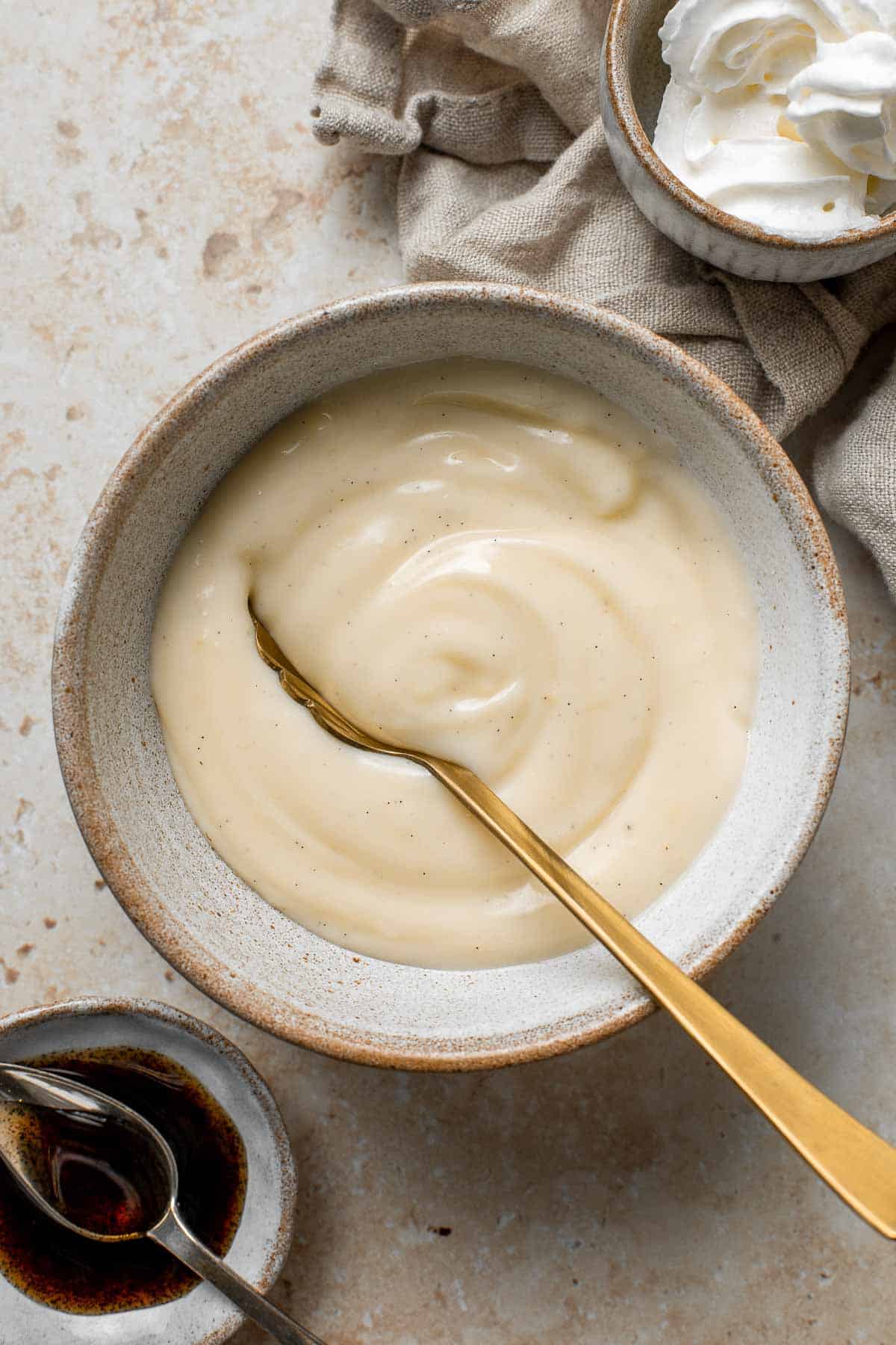 Homemade vanilla pudding is a creamy no bake dessert that you can make with 7 simple ingredients. So much better than boxed pudding mixes or pudding cups. | aheadofthyme.com