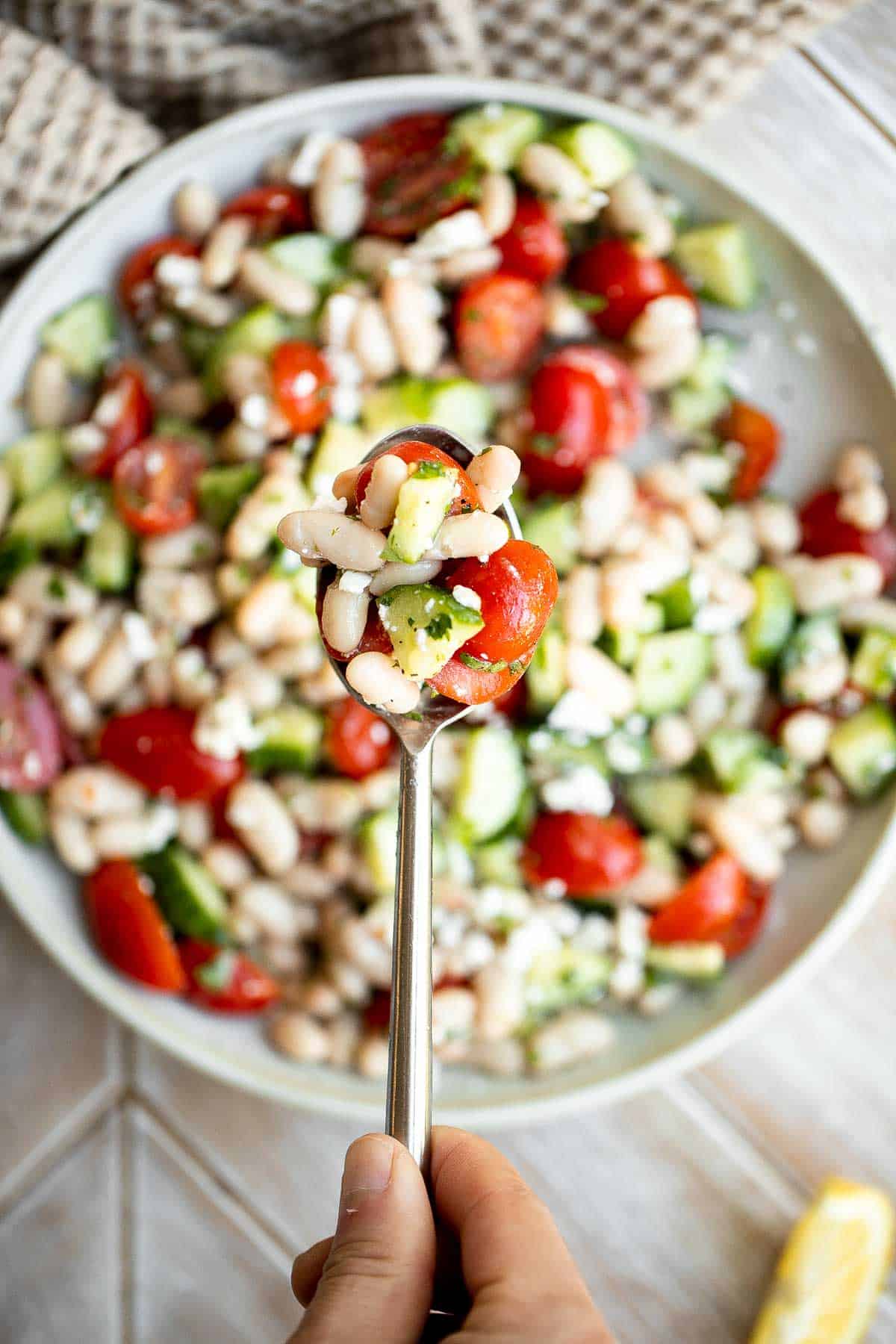 Mediterranean White Bean Salad is loaded with cannellini beans, veggies, feta, and fresh herbs, tossed in a homemade Greek dressing. Perfect for meal prep! | aheadofthyme.com