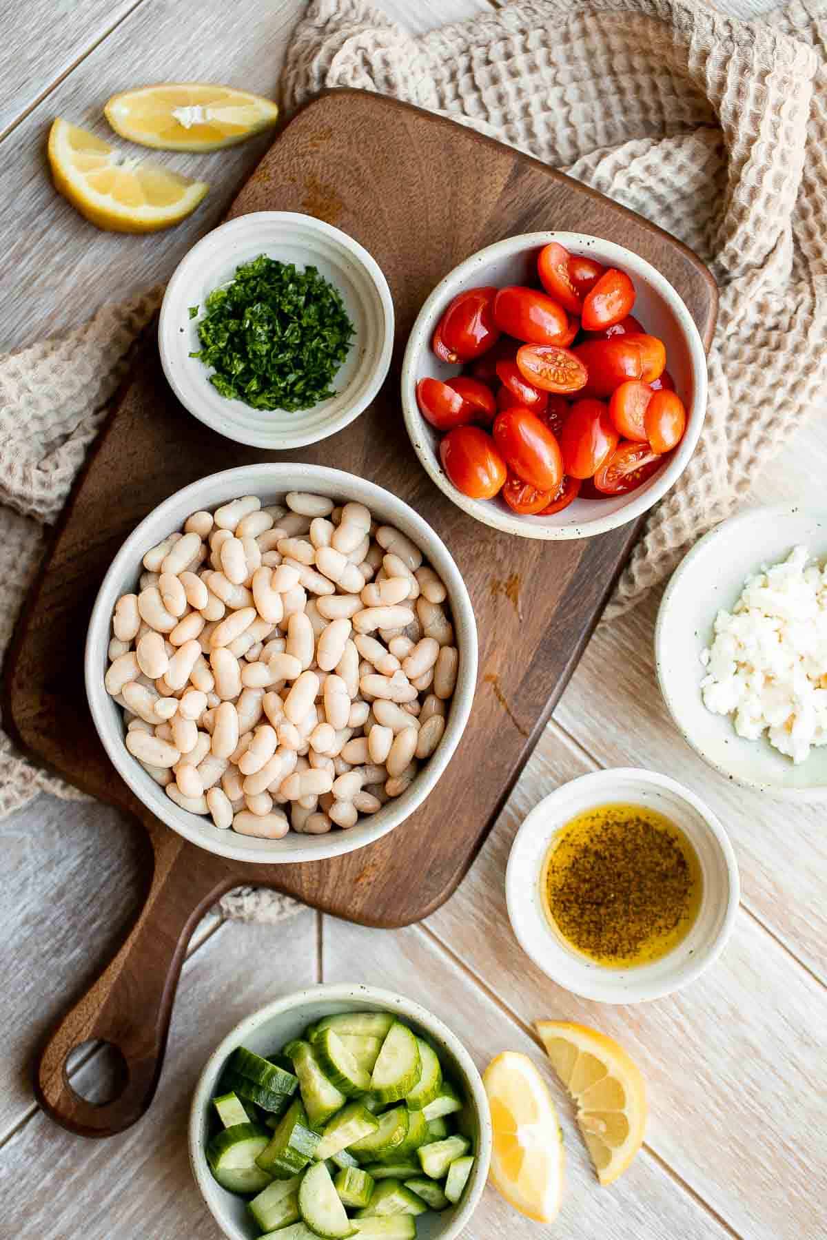 Mediterranean White Bean Salad is loaded with cannellini beans, veggies, feta, and fresh herbs, tossed in a homemade Greek dressing. Perfect for meal prep! | aheadofthyme.com