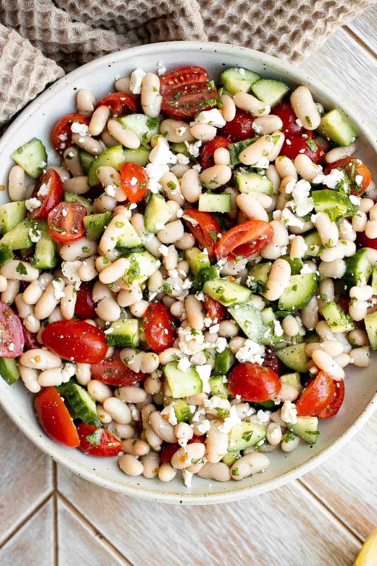 Mediterranean White Bean Salad is loaded with cannellini beans, veggies, feta, and fresh herbs, tossed in a homemade Greek dressing. Perfect for meal prep! | aheadofthyme.com