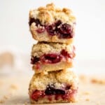 These bakery-style homemade Cherry Crumb Bars with 3 delicious layers are sweet, buttery, and tart. They’re easy to make and ready in just over an hour. | aheadofthyme.com