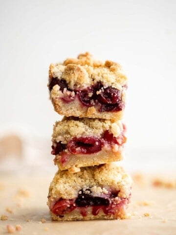 These bakery-style homemade Cherry Crumb Bars with 3 delicious layers are sweet, buttery, and tart. They’re easy to make and ready in just over an hour. | aheadofthyme.com