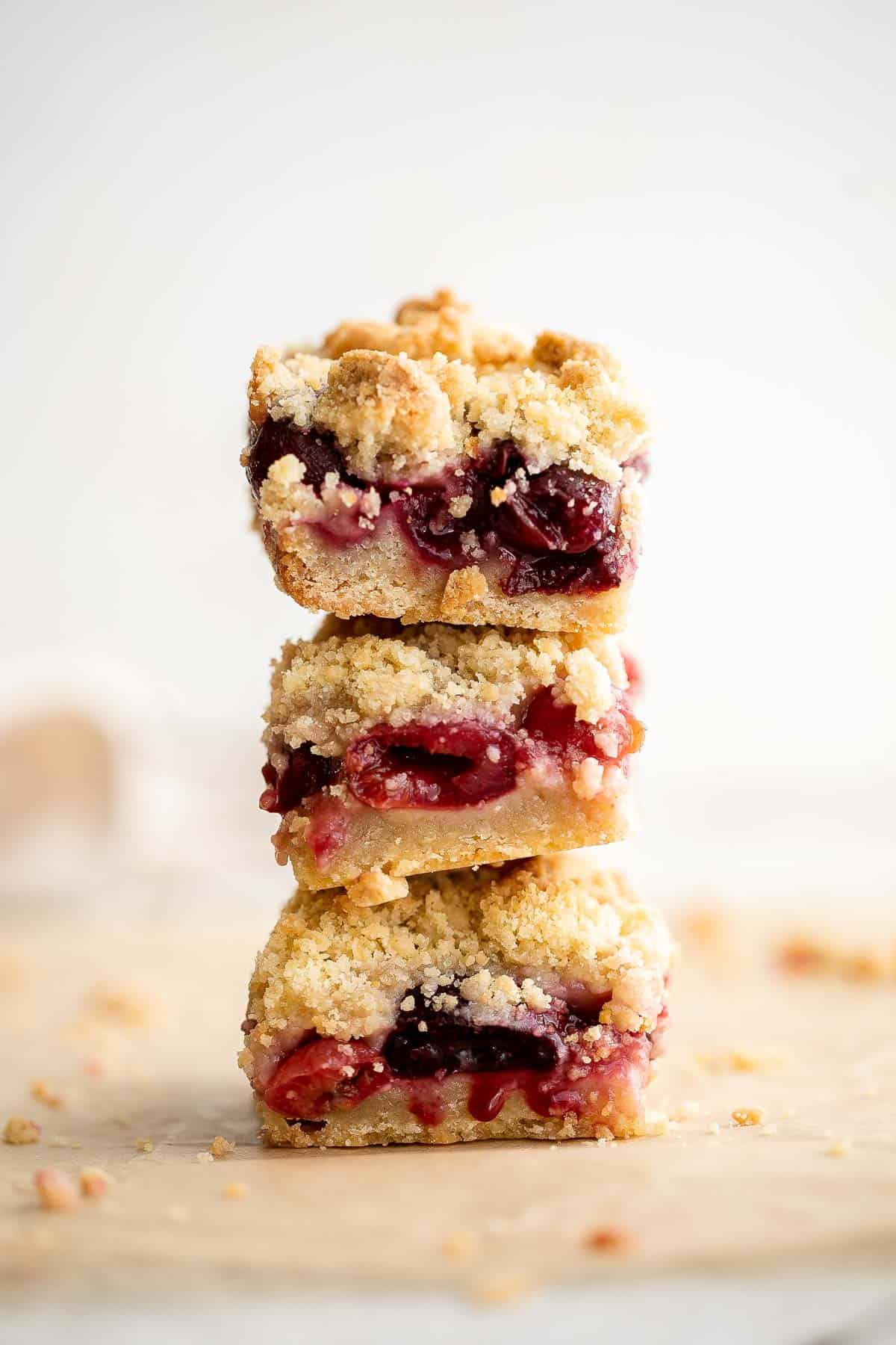 These bakery-style homemade Cherry Crumb Bars with 3 delicious layers are sweet, buttery, and tart. They’re easy to make and ready in just over an hour. | aheadofthyme.com