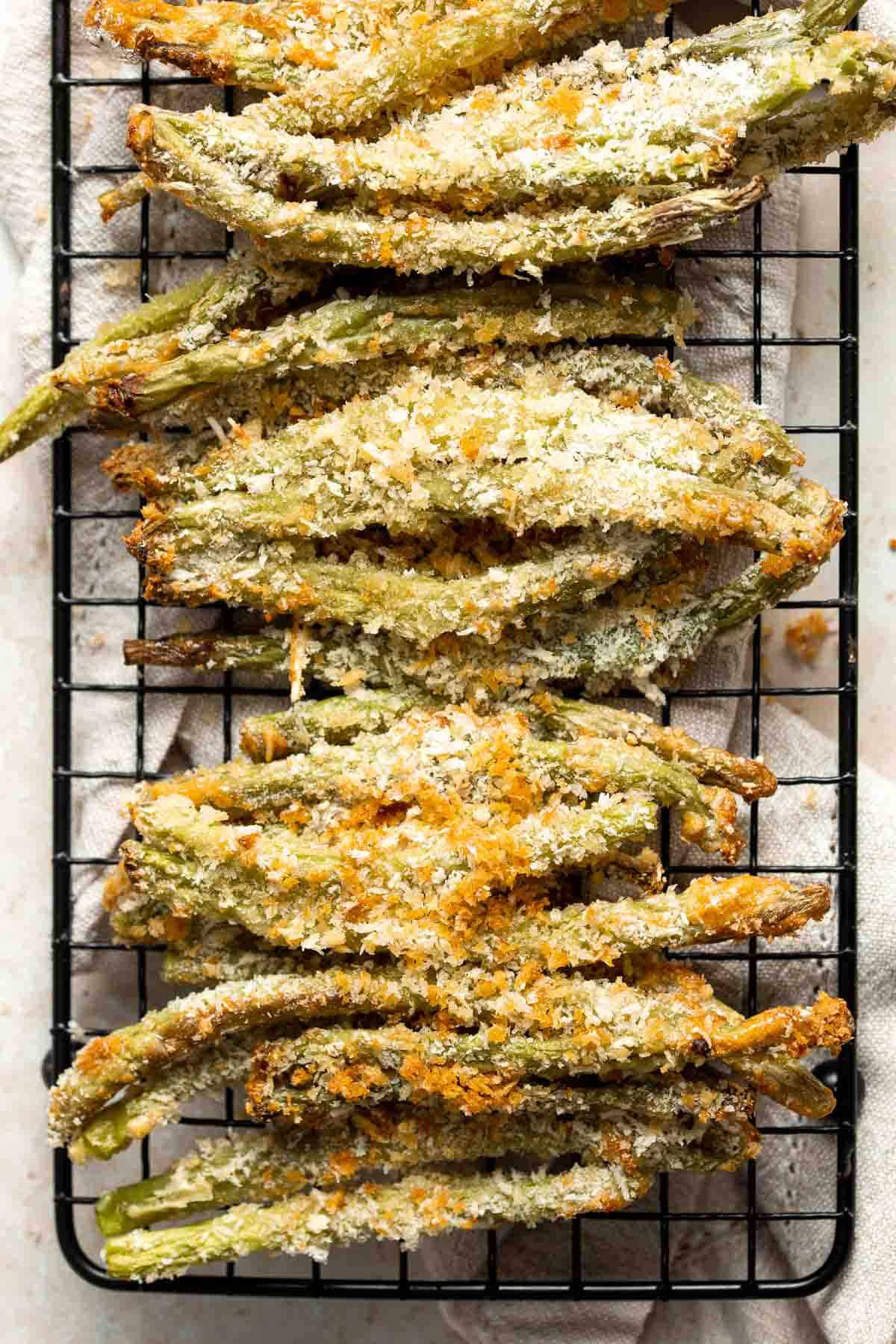 Baked green bean fries are flavorful, crispy, and nutritious. These veggies are quick and easy to make as a healthy appetizer, snack, or side dish. | aheadofthyme.com