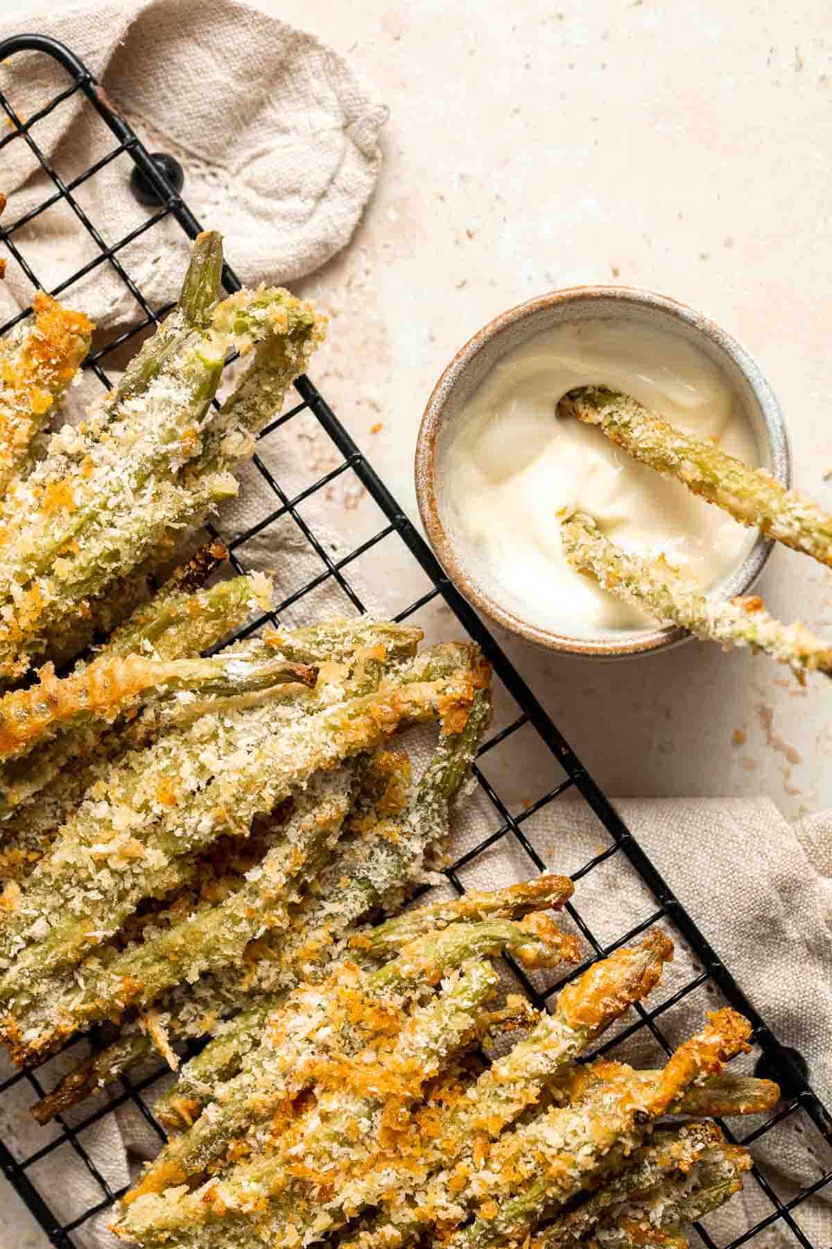 Baked green bean fries are flavorful, crispy, and nutritious. These veggies are quick and easy to make as a healthy appetizer, snack, or side dish. | aheadofthyme.com