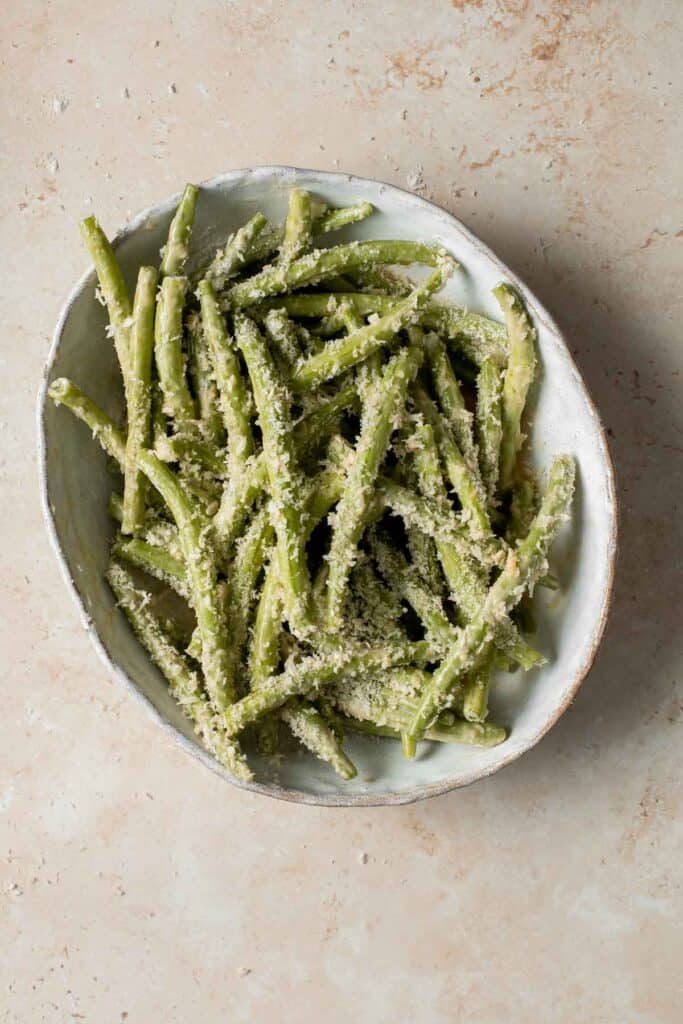 Baked green bean fries are flavorful, crispy, and nutritious. These veggies are quick and easy to make as a healthy appetizer, snack, or side dish. | aheadofthyme.com