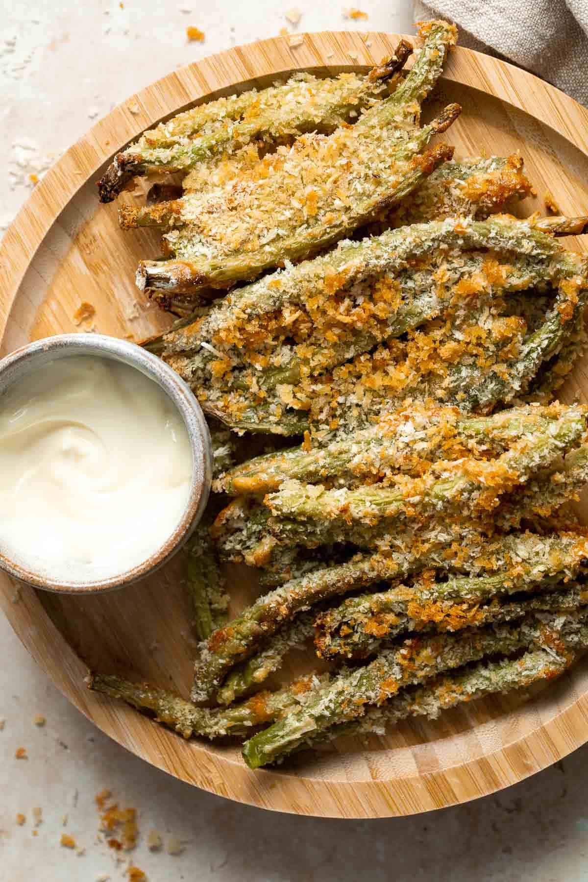 Baked green bean fries are flavorful, crispy, and nutritious. These veggies are quick and easy to make as a healthy appetizer, snack, or side dish. | aheadofthyme.com