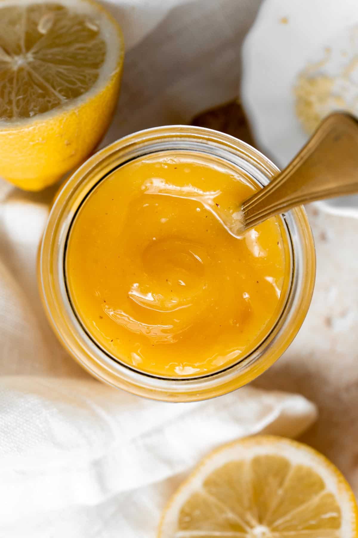 Homemade Lemon Curd is rich, creamy, sweet, and tangy. This delicious fruit curd is easy to make with just 6 simple ingredients and a few basic steps. | aheadofthyme.com