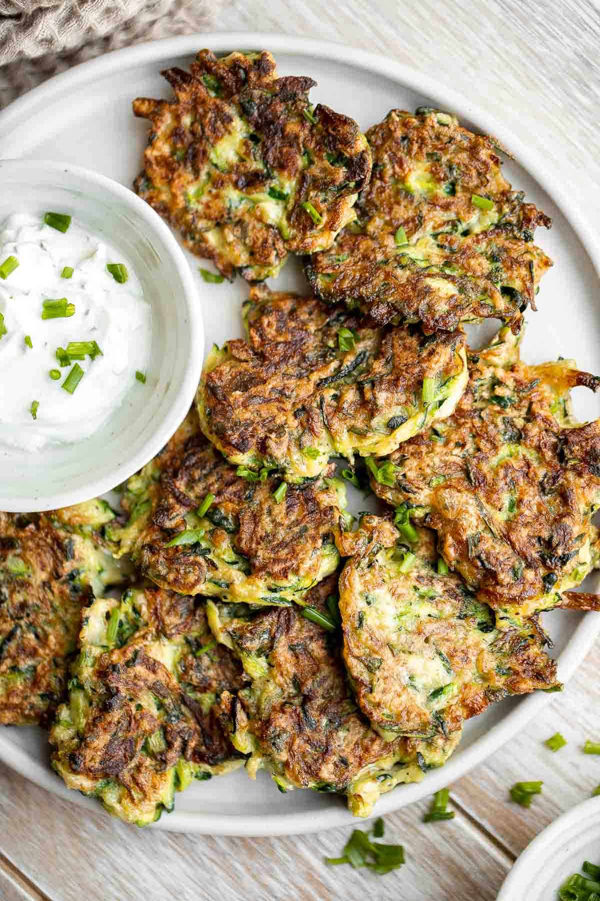 Zucchini fritters are crispy outside, tender inside, and loaded with zucchini. These healthy bites are one of my favorite ways to use up summer zucchini. | aheadofthyme.com