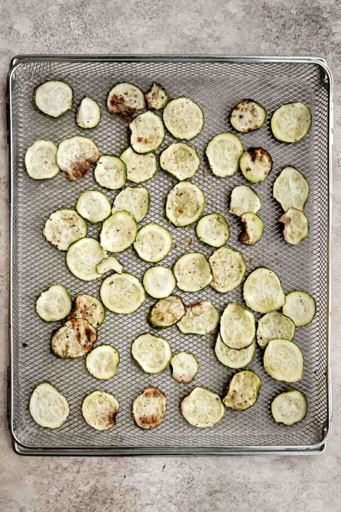 Air fryer zucchini chips make an excellent snack or side dish — they are savory, salty, and flavorful! A quick and easy recipe made with 5 ingredients. | aheadofthyme.com