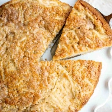 Easy Apple Cake has a dense and moist crumb and is loaded with fresh apples, cinnamon sugar, and nuts. It’s quick, easy, and ready to eat in under an hour. | aheadofthyme.com