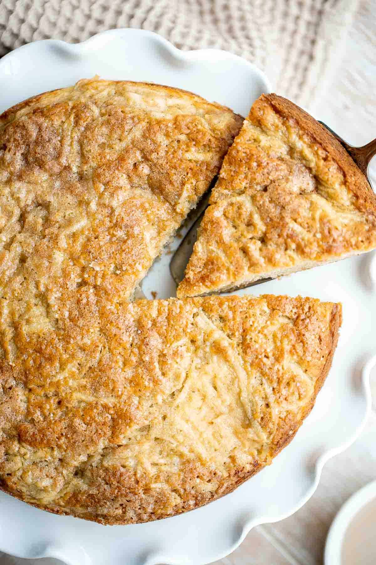 Easy Apple Cake has a dense and moist crumb and is loaded with fresh apples, cinnamon sugar, and nuts. It’s quick, easy, and ready to eat in under an hour. | aheadofthyme.com