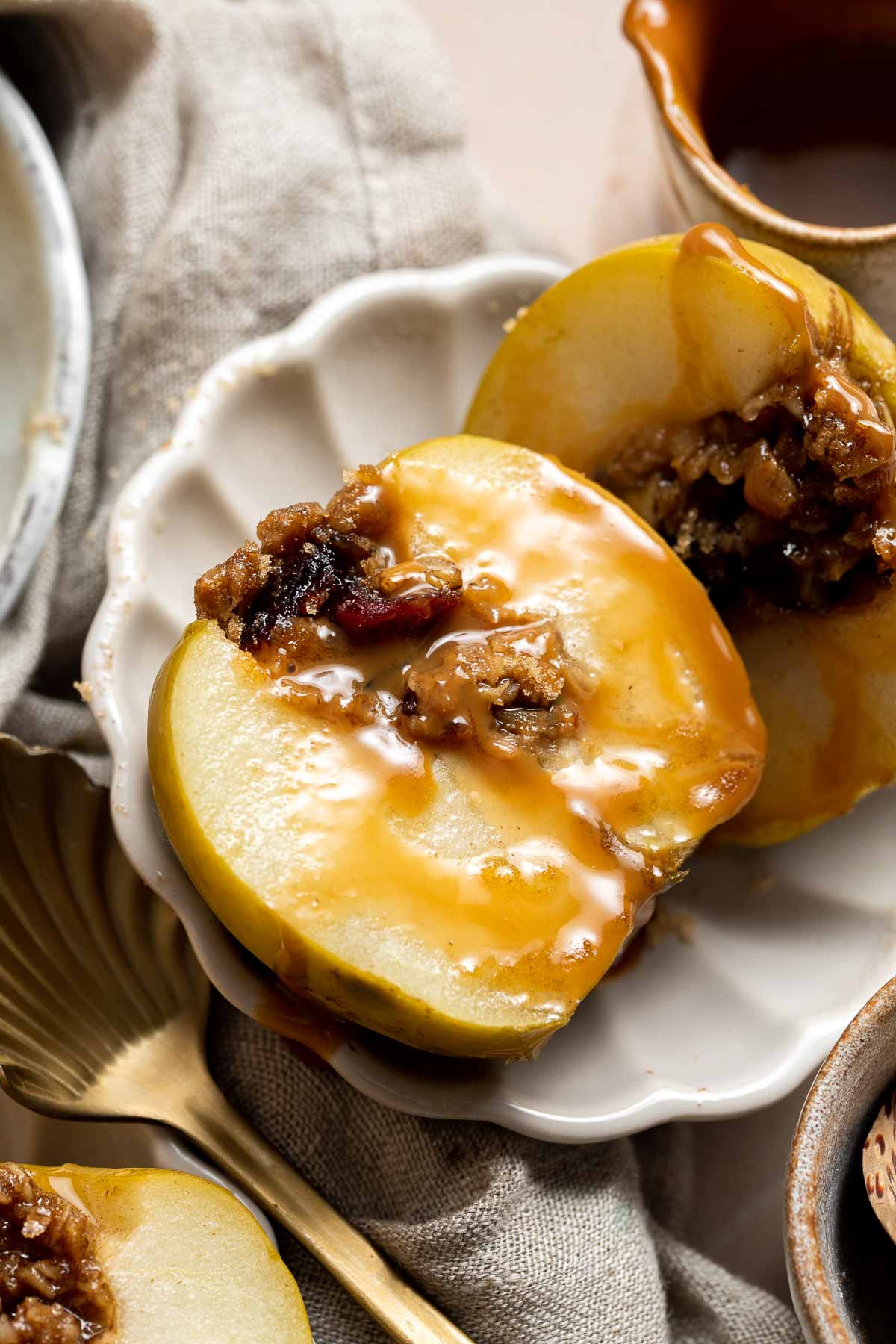 Baked Apples are soft, warm, and tender, with a crunchy sweet cinnamon oat filling. This cozy and comforting fall dessert is quick easy to make too. | aheadofthyme.com