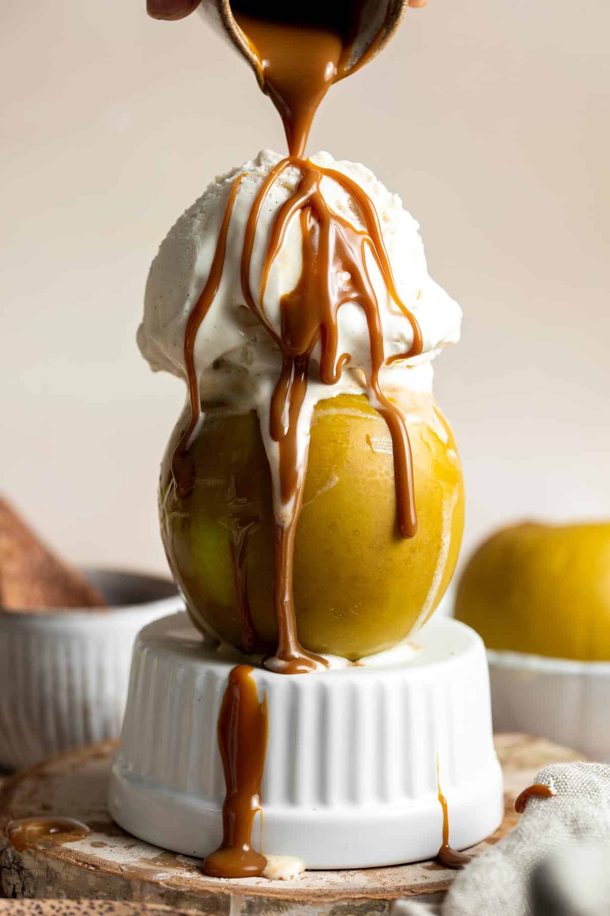 Baked Apples are soft, warm, and tender, with a crunchy sweet cinnamon oat filling. This cozy and comforting fall dessert is quick easy to make too. | aheadofthyme.com