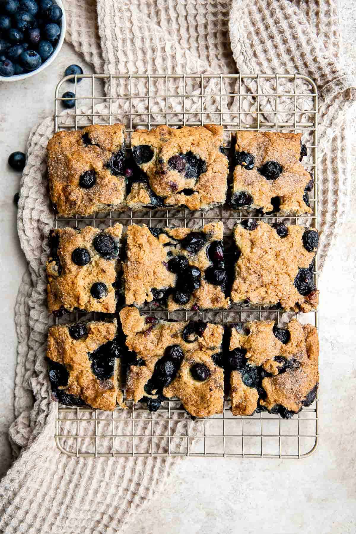 This Blueberry Cake is dense, moist, and chock-full of delicious blueberries with a dusting of cinnamon sugar on top. Prep this coffee cake in 10 minutes. | aheadofthyme.com