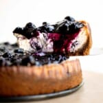 This Blueberry Cheesecake is rich, sweet, and smooth with a creamy cheesecake layer packed with blueberries and topped with sweet blueberry sauce. | aheadofthyme.com