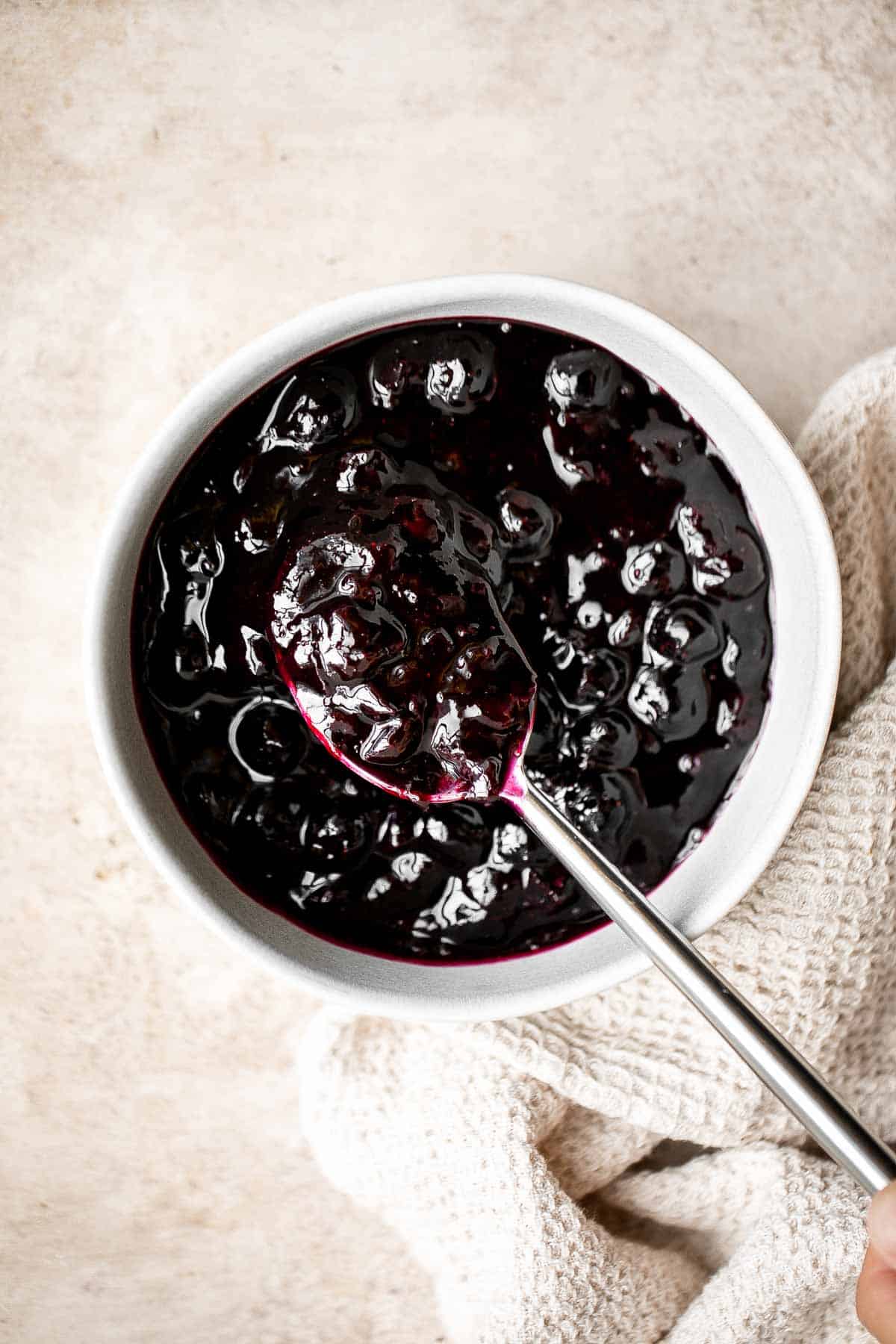 Blueberry Sauce is easy to make with a handful of simple ingredients in 15 minutes. It’s the perfect thick, fruity syrup to add to breakfast or dessert. | aheadofthyme.com