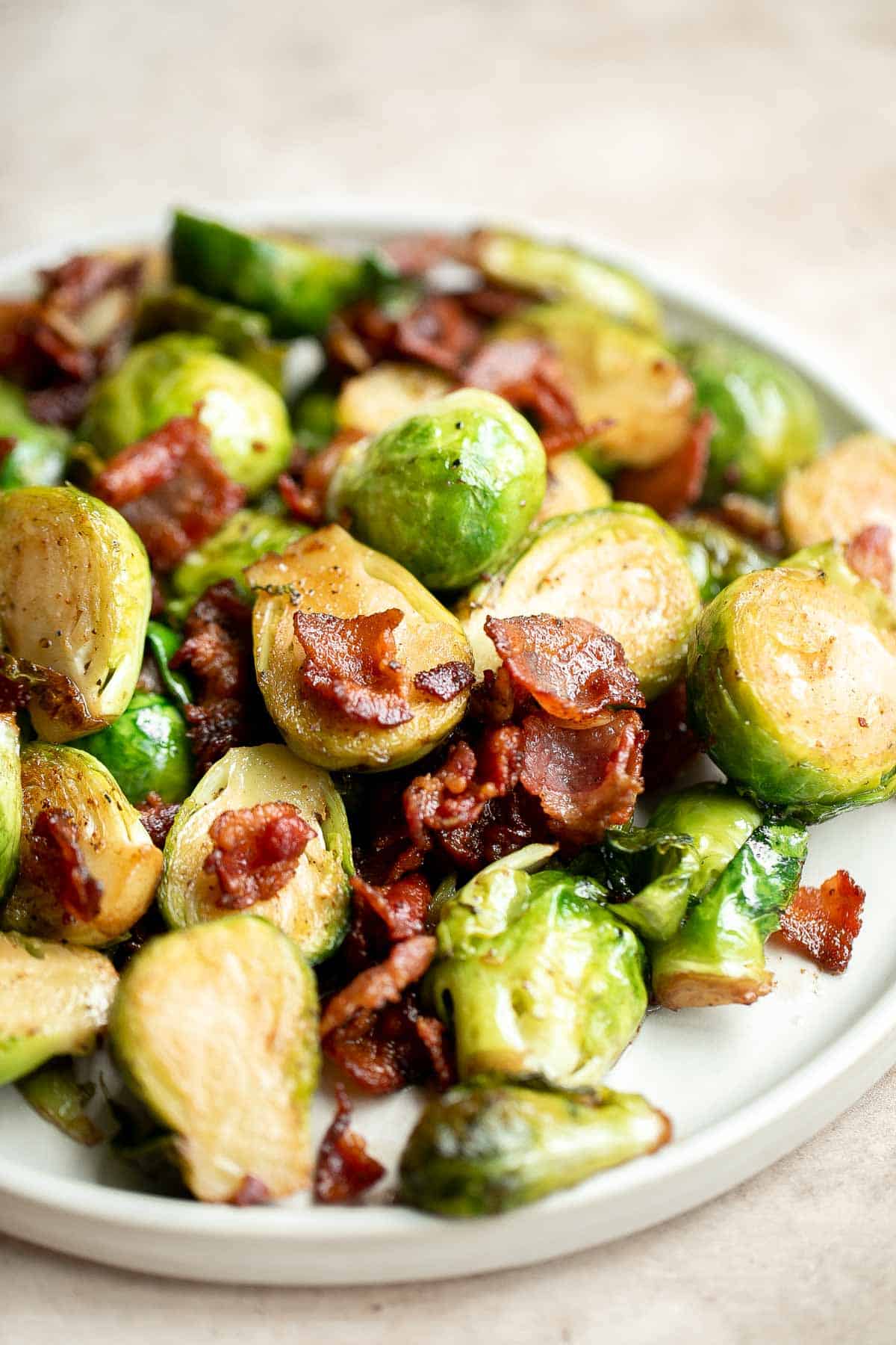 Brussels Sprouts with Bacon is a quick and easy side dish with the best flavor and texture. The best part? This holiday side is ready in under 15 minutes. | aheadofthyme.com