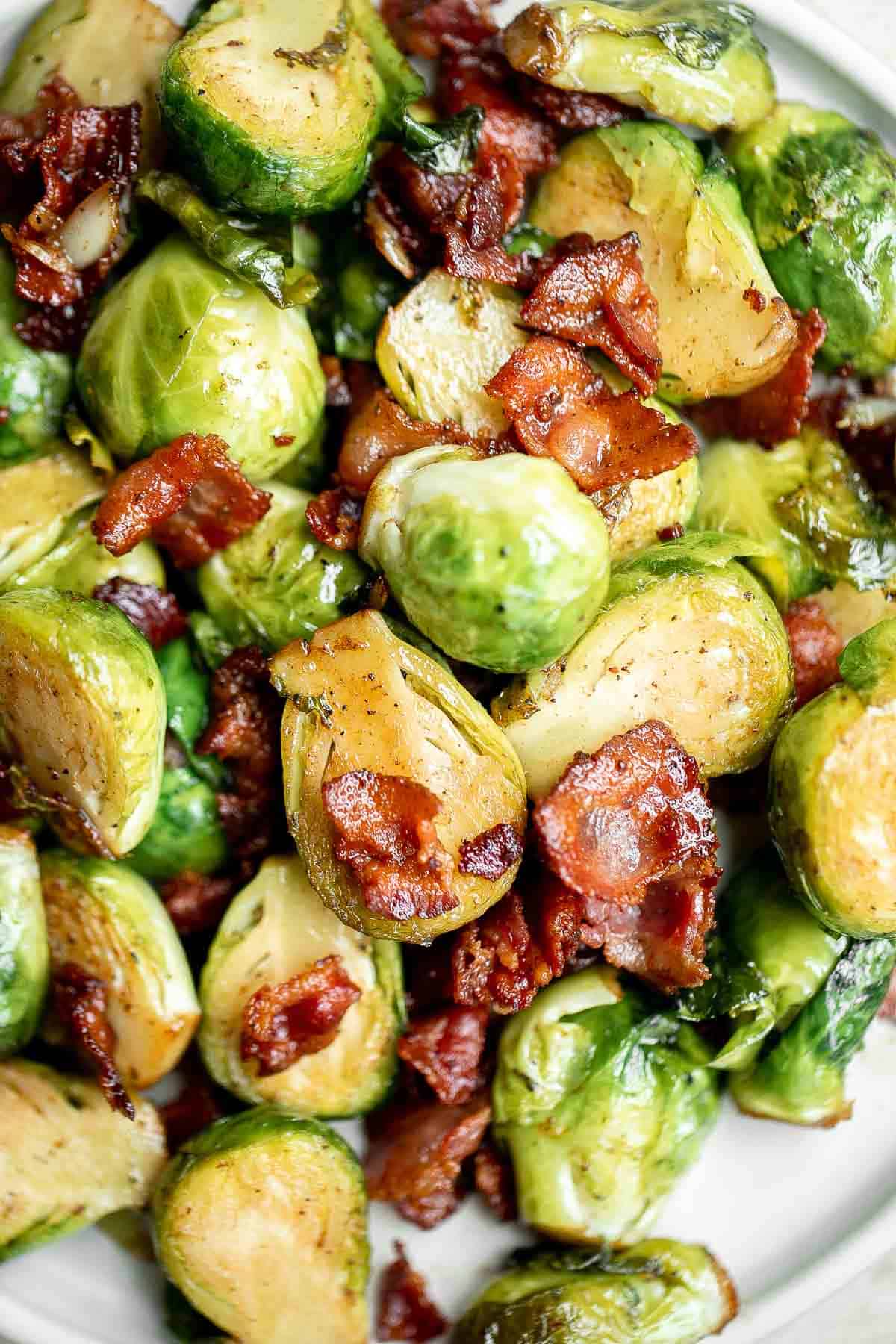 Brussels Sprouts with Bacon is a quick and easy side dish with the best flavor and texture. The best part? This holiday side is ready in under 15 minutes. | aheadofthyme.com