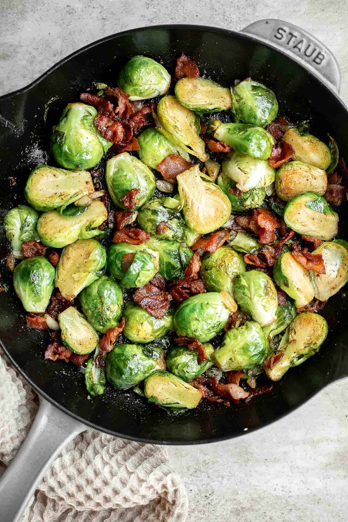 Brussels Sprouts with Bacon is a quick and easy side dish with the best flavor and texture. The best part? This holiday side is ready in under 15 minutes. | aheadofthyme.com