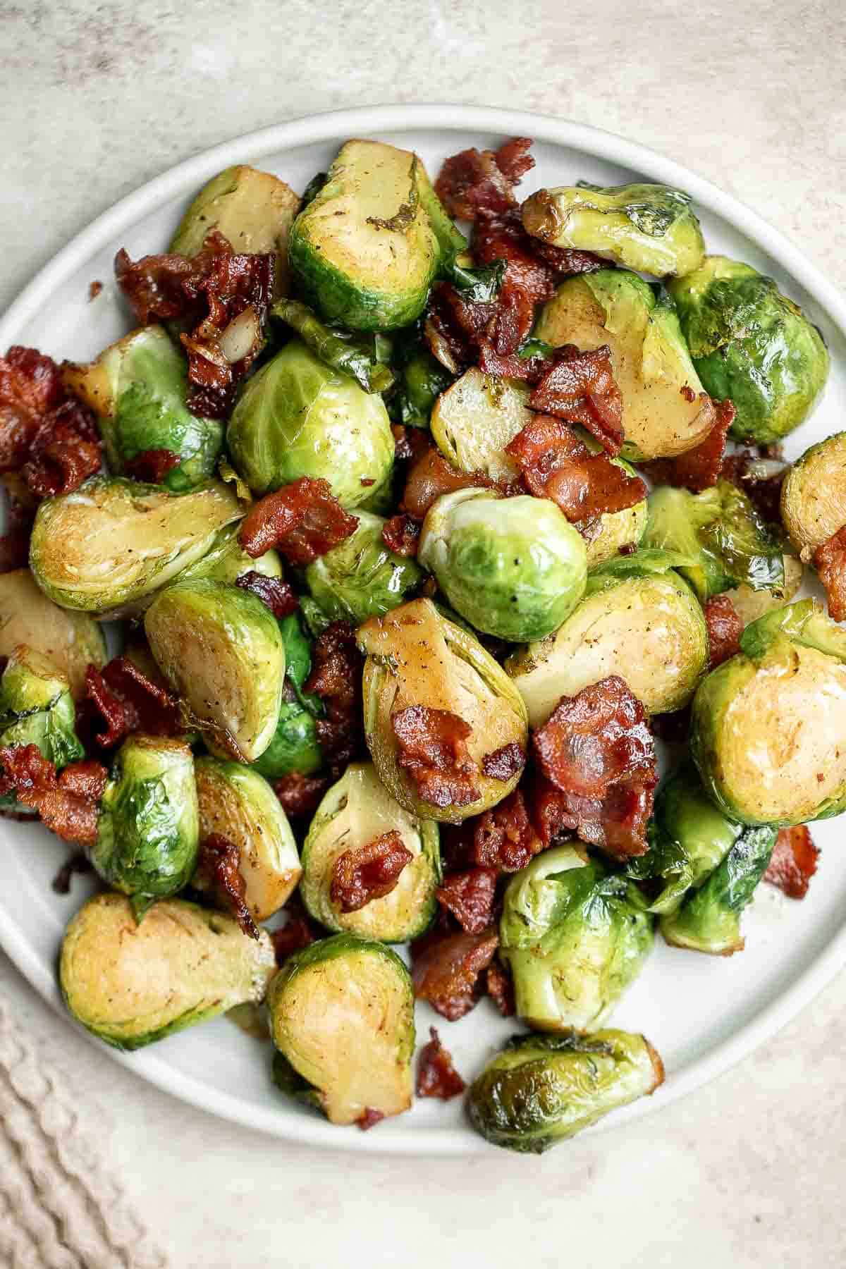 Brussels Sprouts with Bacon is a quick and easy side dish with the best flavor and texture. The best part? This holiday side is ready in under 15 minutes. | aheadofthyme.com