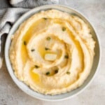 Cheddar Mashed Potatoes are fluffy, creamy, and buttery. Loaded with cheese and hints of garlic, every bite of this classic side dish is flavorful. | aheadofthyme.com