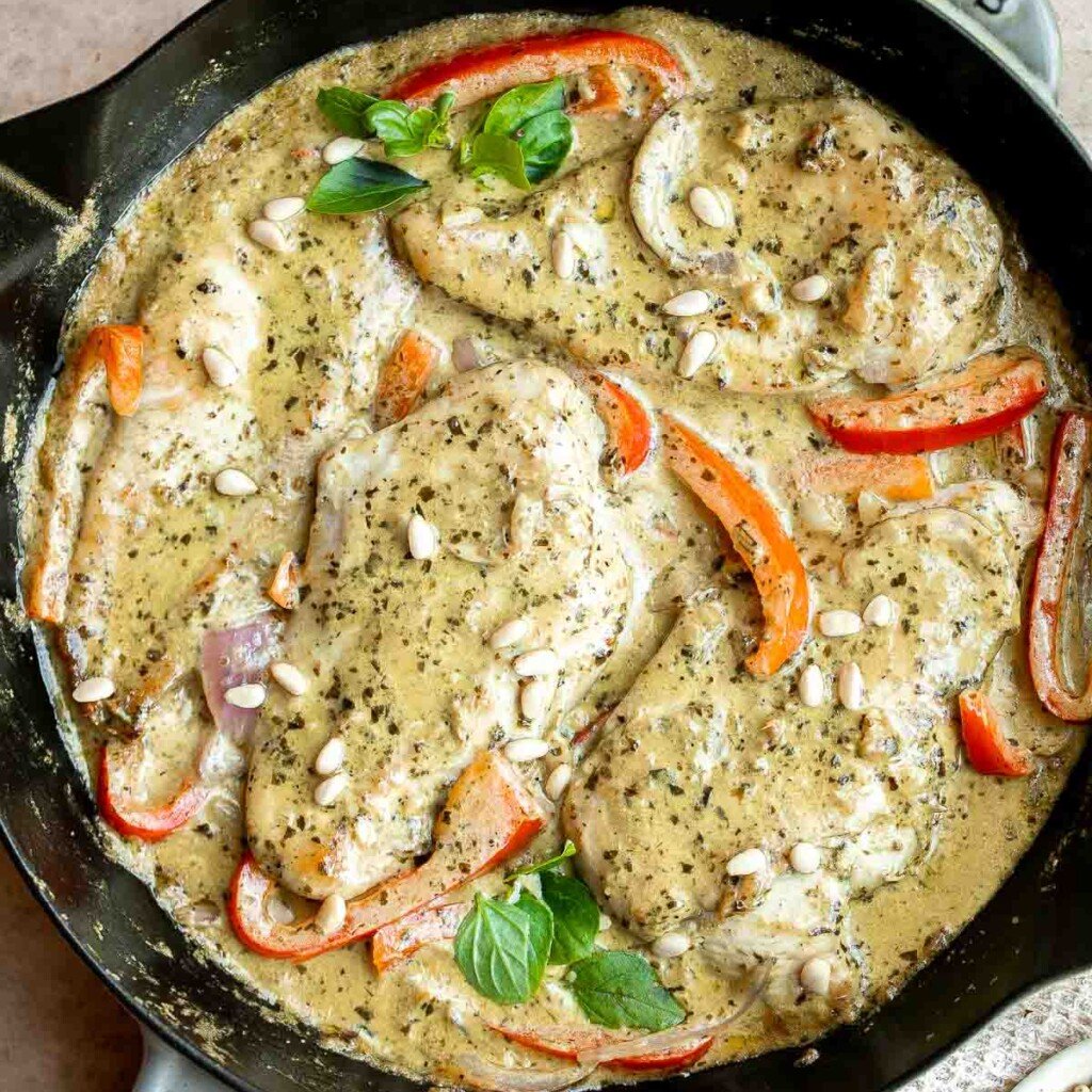 Creamy Pesto Chicken is a quick, 30 minute one-pan dinner with juicy chicken breasts in a rich, flavorful pesto sauce. Weeknight easy, date-night worthy. | aheadofthyme.com