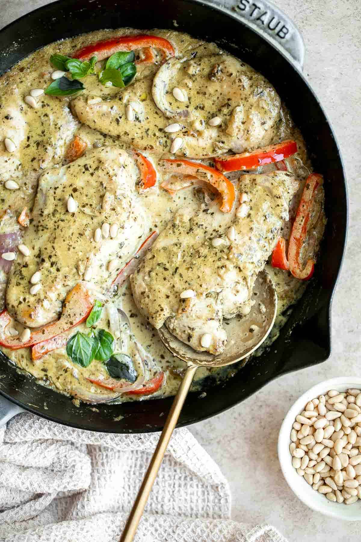 Creamy Pesto Chicken is a quick and easy 30 minute meal that needs to be on your family weeknight dinner rotation. It's rich, creamy, and delicious. | aheadofthyme.com