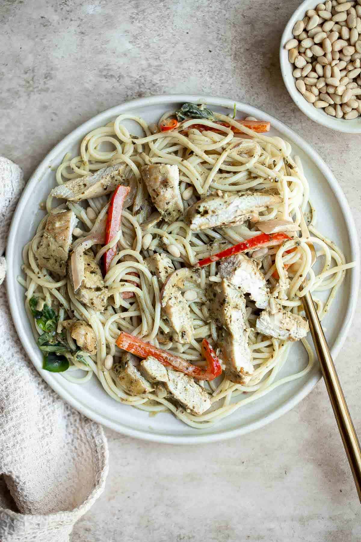 Creamy Pesto Chicken is a quick and easy 30 minute meal that needs to be on your family weeknight dinner rotation. It's rich, creamy, and delicious. | aheadofthyme.com