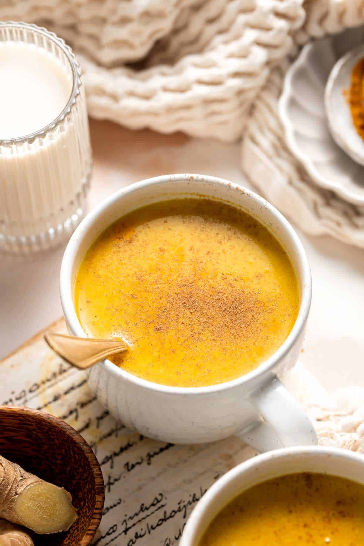 Golden Milk Turmeric Latte is an Indian herbal tea that is quick and easy to make, loaded with natural soothing properties, and great for immunity. | aheadofthyme.com