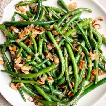 Green Beans Almondine is buttery, garlicky, and nutty. This classic French side dish is quick and easy to make, and loaded with flavor and texture. | aheadofthyme.com