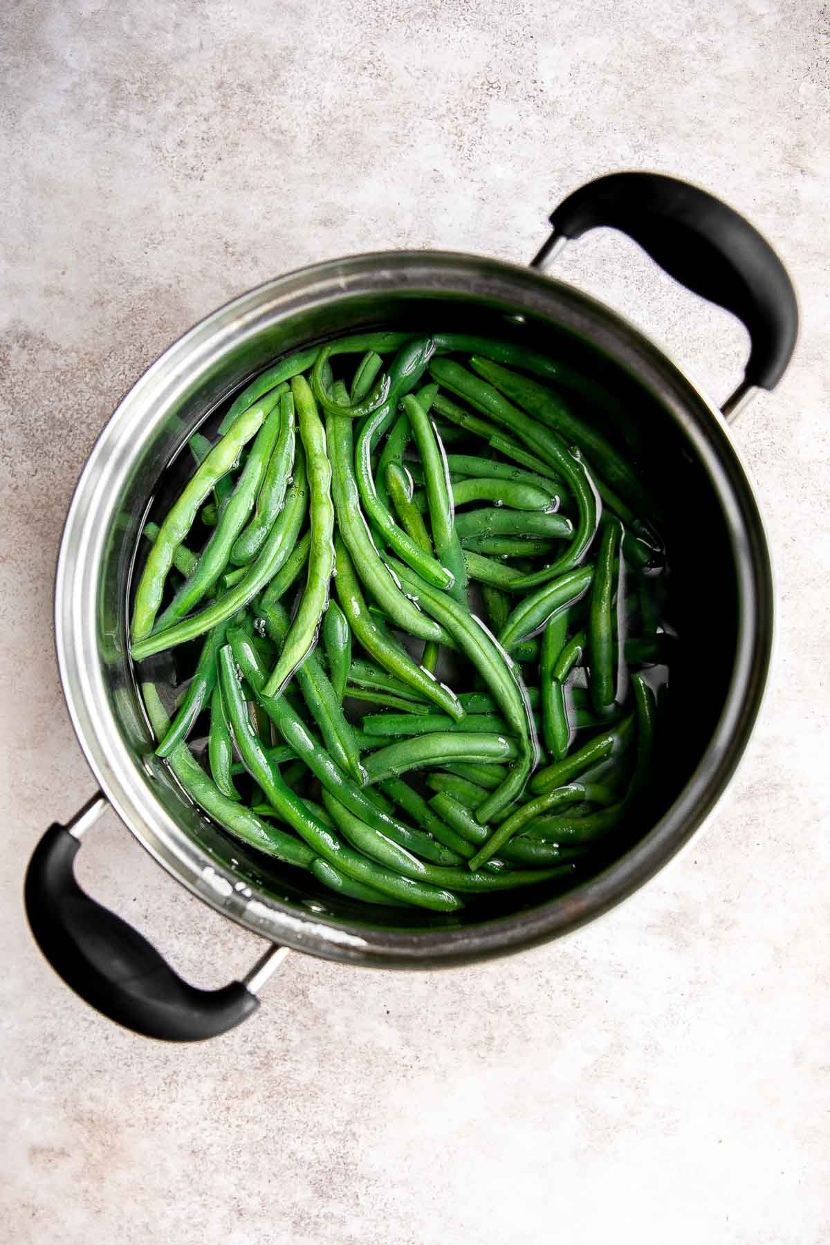 Green Beans Almondine is buttery, garlicky, and nutty. This classic French side dish is quick and easy to make, and loaded with flavor and texture. | aheadofthyme.com