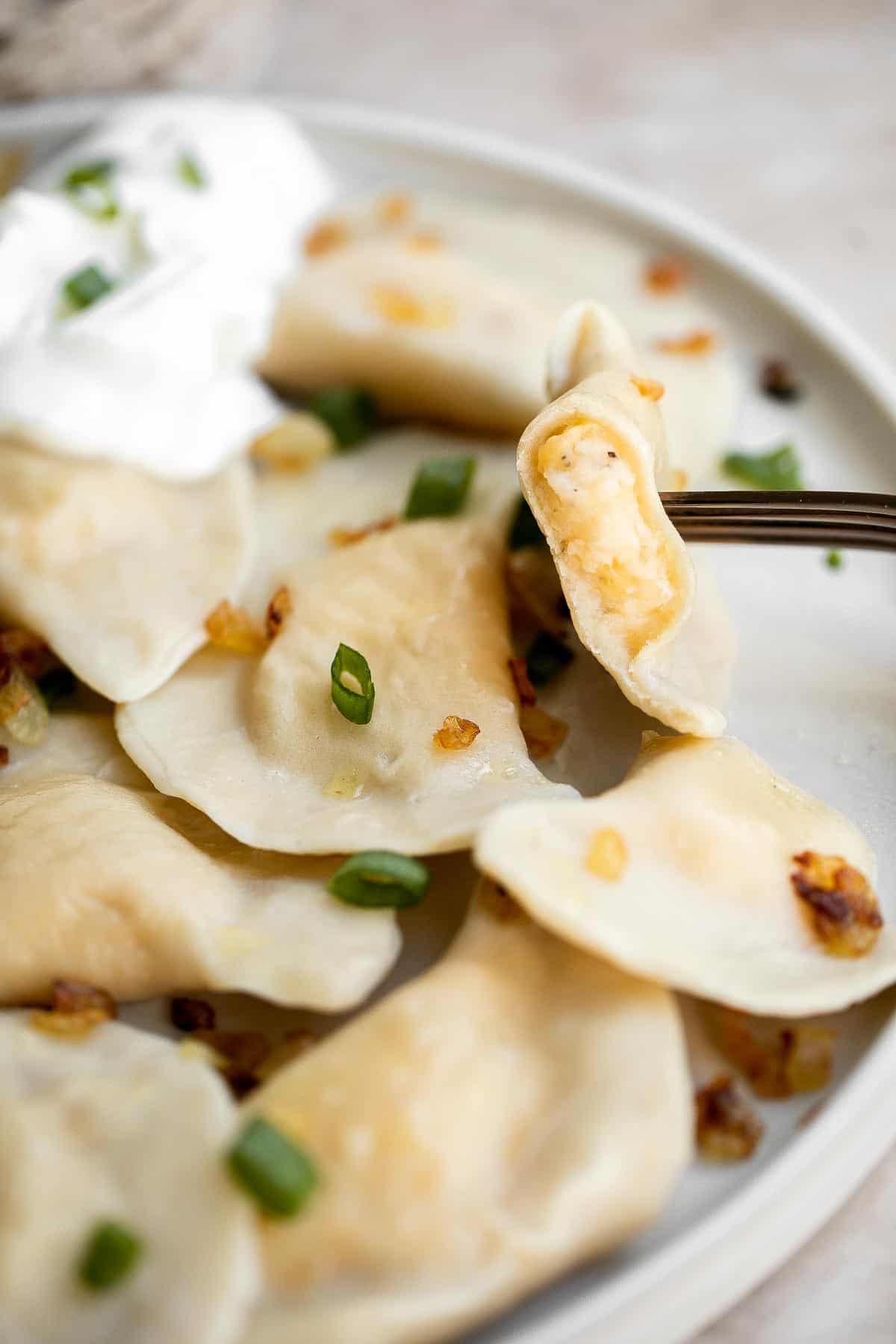 Homemade Potato and Cheese Perogies are comforting, delicious, and satisfying. These cheddar pierogi from scratch as easier to make than you think! | aheadofthyme.com