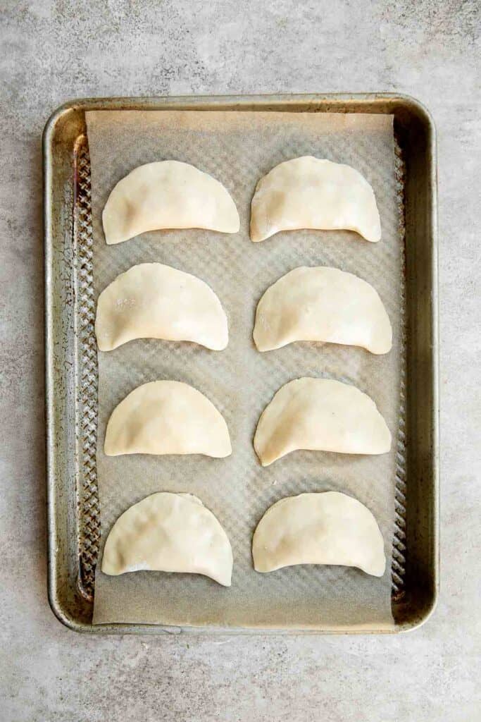 Homemade Potato and Cheese Perogies are comforting, delicious, and satisfying. These cheddar pierogi from scratch as easier to make than you think! | aheadofthyme.com