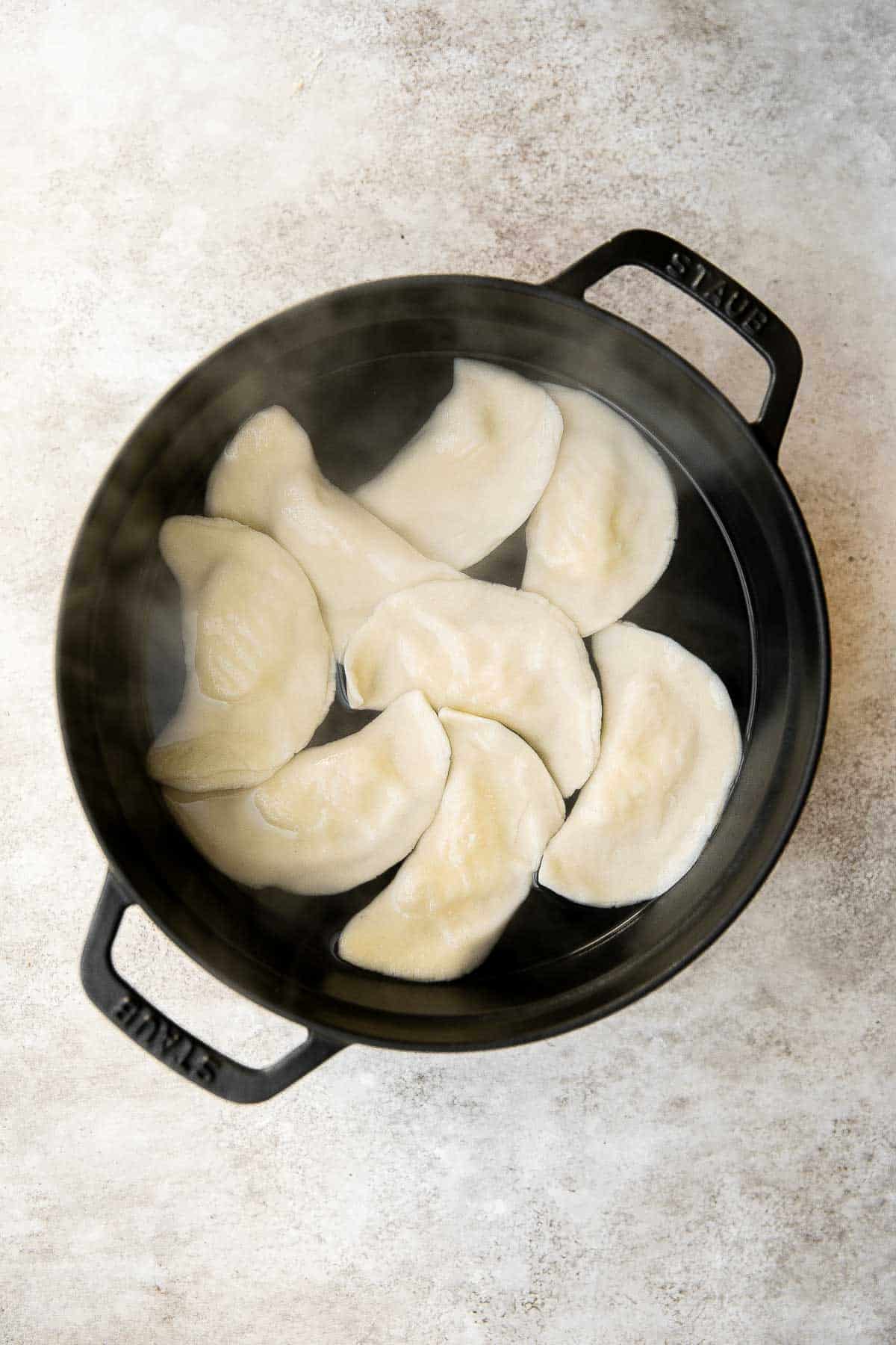 Homemade Potato and Cheese Perogies are comforting, delicious, and satisfying. These cheddar pierogi from scratch as easier to make than you think! | aheadofthyme.com