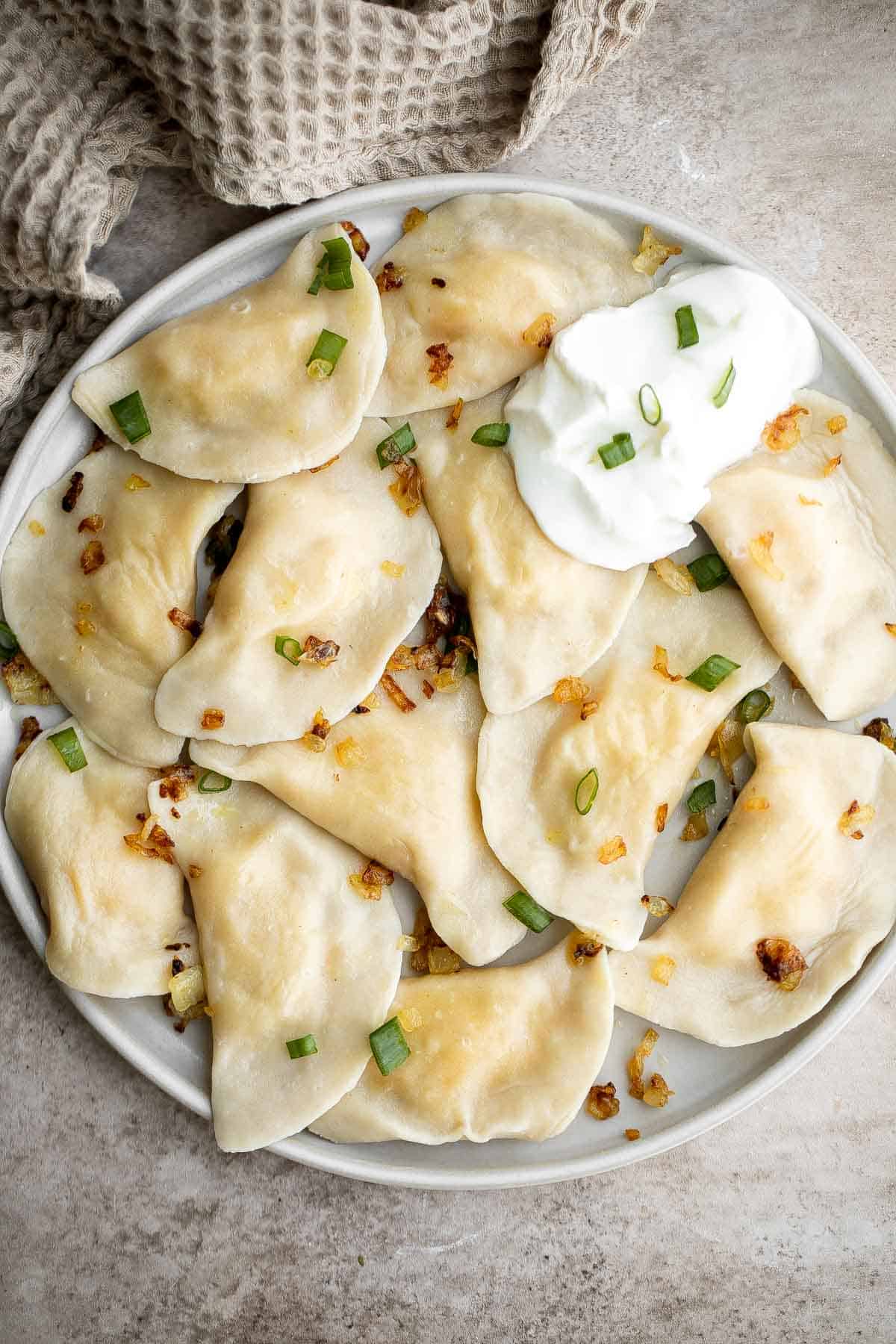 Homemade Potato and Cheese Perogies are comforting, delicious, and satisfying. These cheddar pierogi from scratch as easier to make than you think! | aheadofthyme.com
