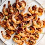 Grilled honey garlic shrimp skewers marinated in a flavorful Asian marinade are sweet and savory, loaded with flavor, and ready in 25 minutes. | aheadofthyme.com