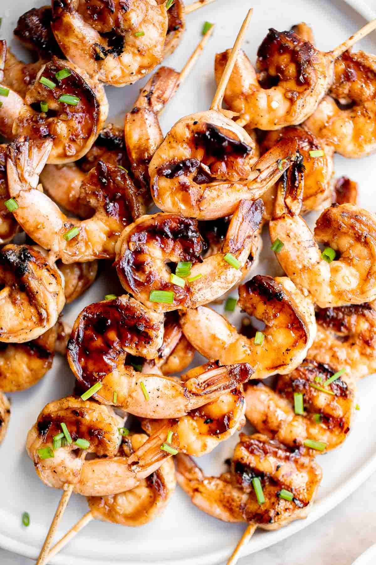 Grilled honey garlic shrimp skewers marinated in a flavorful Asian marinade are sweet and savory, loaded with flavor, and ready in 25 minutes. | aheadofthyme.com