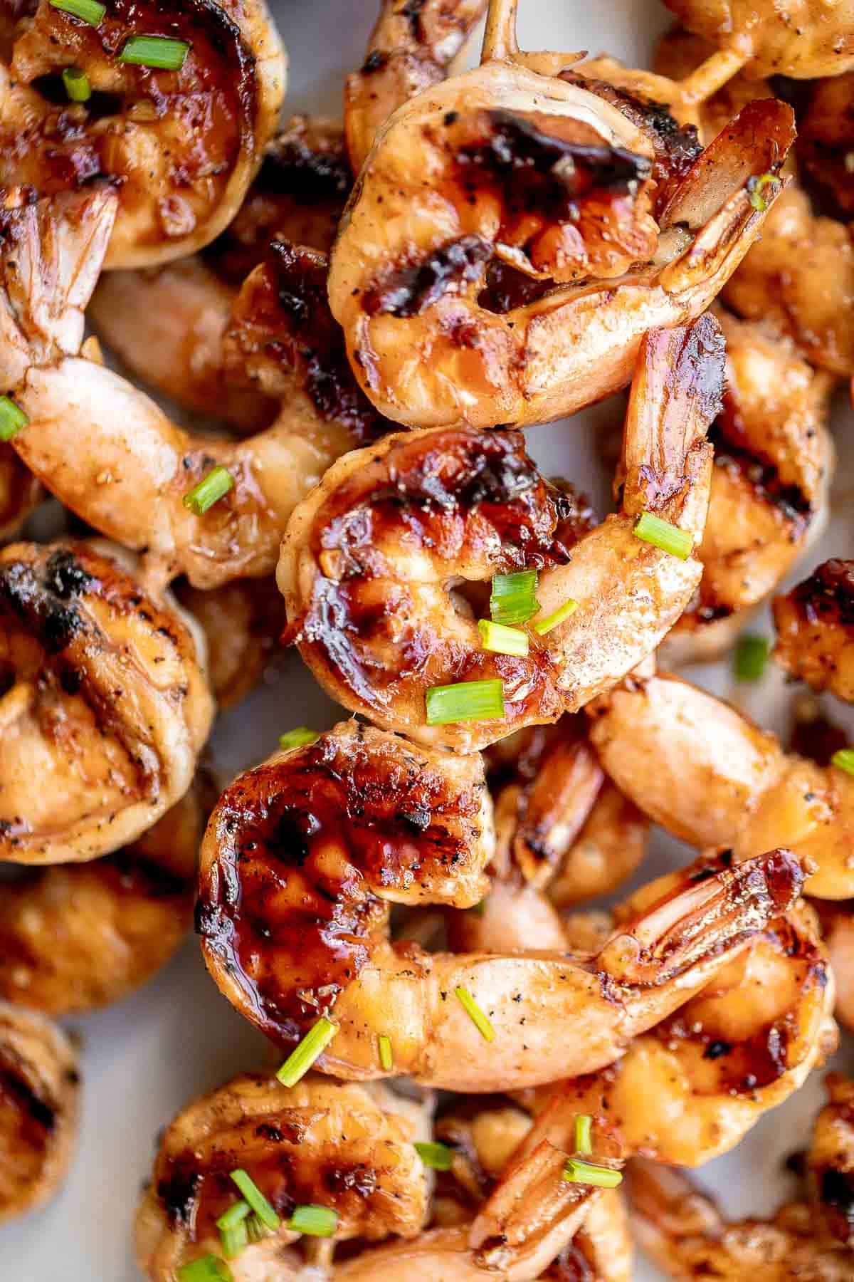 Grilled honey garlic shrimp skewers marinated in a flavorful Asian marinade are sweet and savory, loaded with flavor, and ready in 25 minutes. | aheadofthyme.com