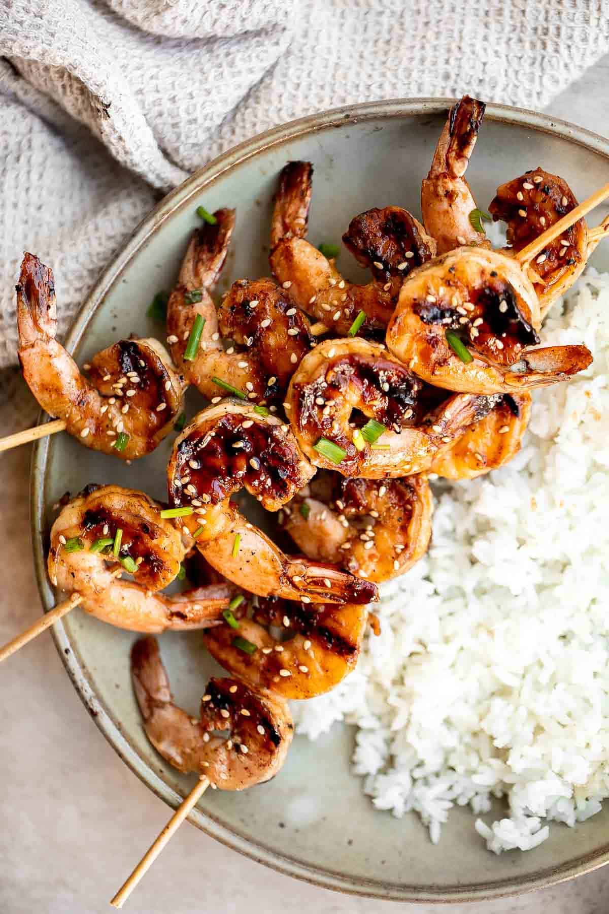 Grilled honey garlic shrimp skewers marinated in a flavorful Asian marinade are sweet and savory, loaded with flavor, and ready in 25 minutes. | aheadofthyme.com