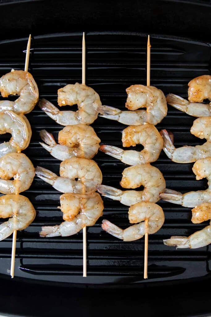 Grilled honey garlic shrimp skewers marinated in a flavorful Asian marinade are sweet and savory, loaded with flavor, and ready in 25 minutes. | aheadofthyme.com