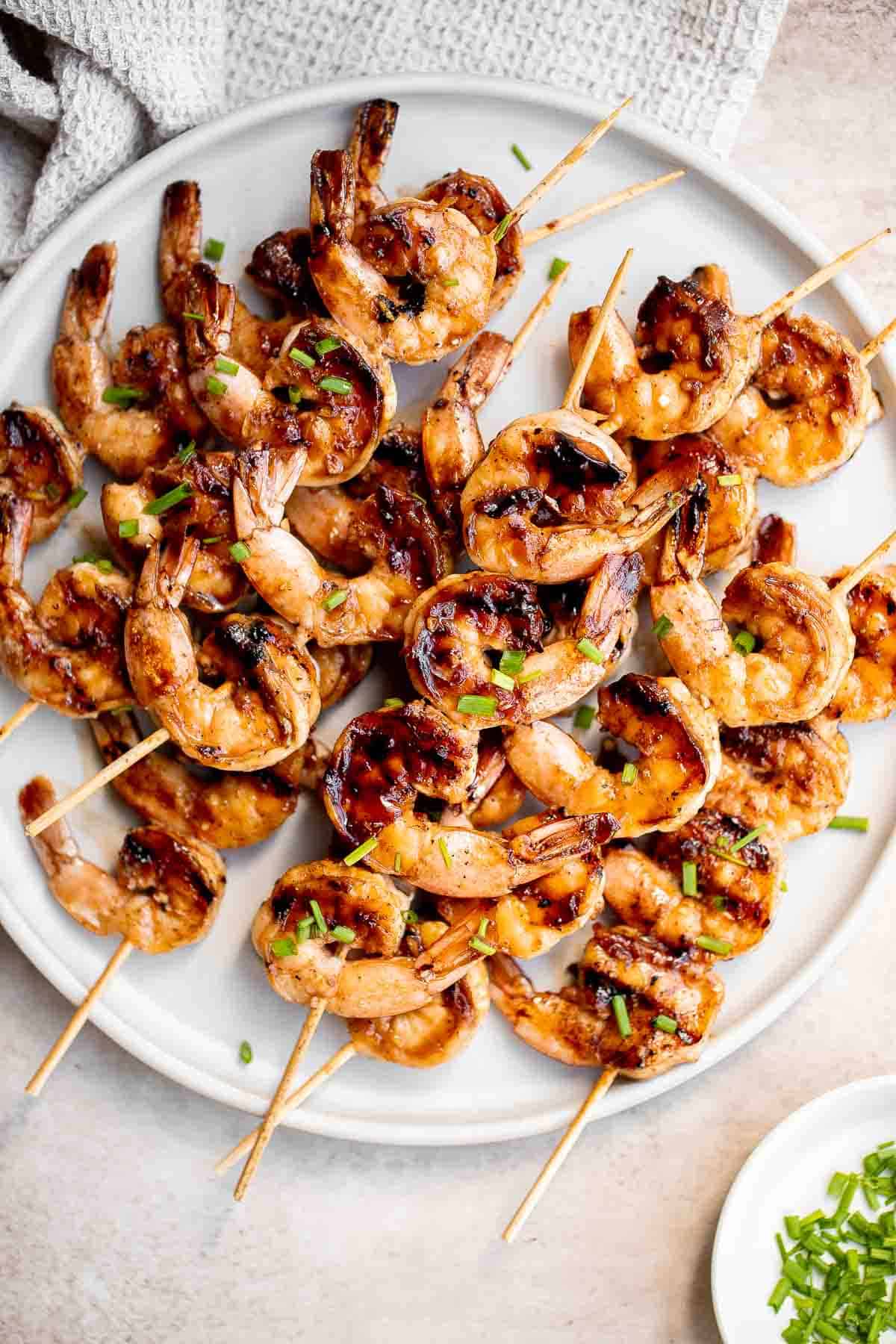 Grilled honey garlic shrimp skewers marinated in a flavorful Asian marinade are sweet and savory, loaded with flavor, and ready in 25 minutes. | aheadofthyme.com