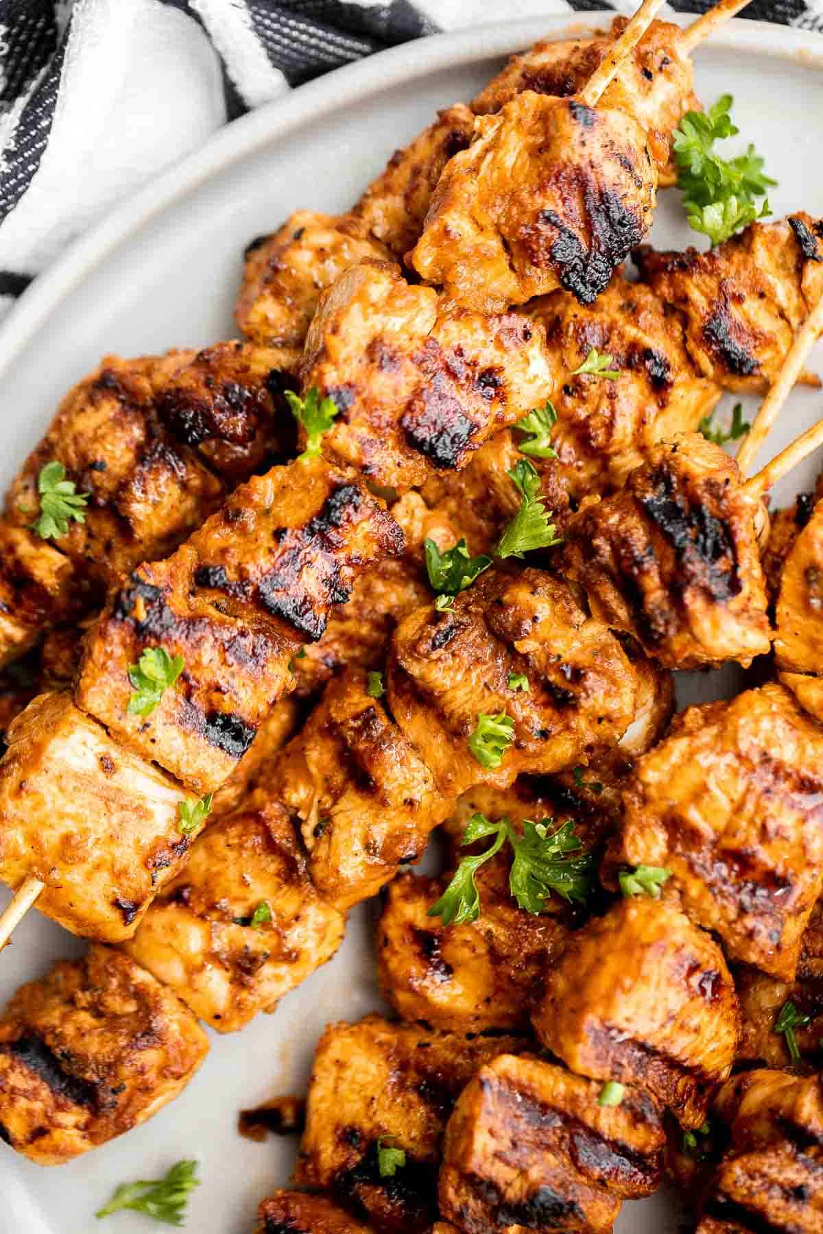 Italian Chicken Skewers are an easy, delicious, and flavorful grilled chicken dinner made with juicy chicken bites smothered in a herby tomato marinade. | aheadofthyme.com