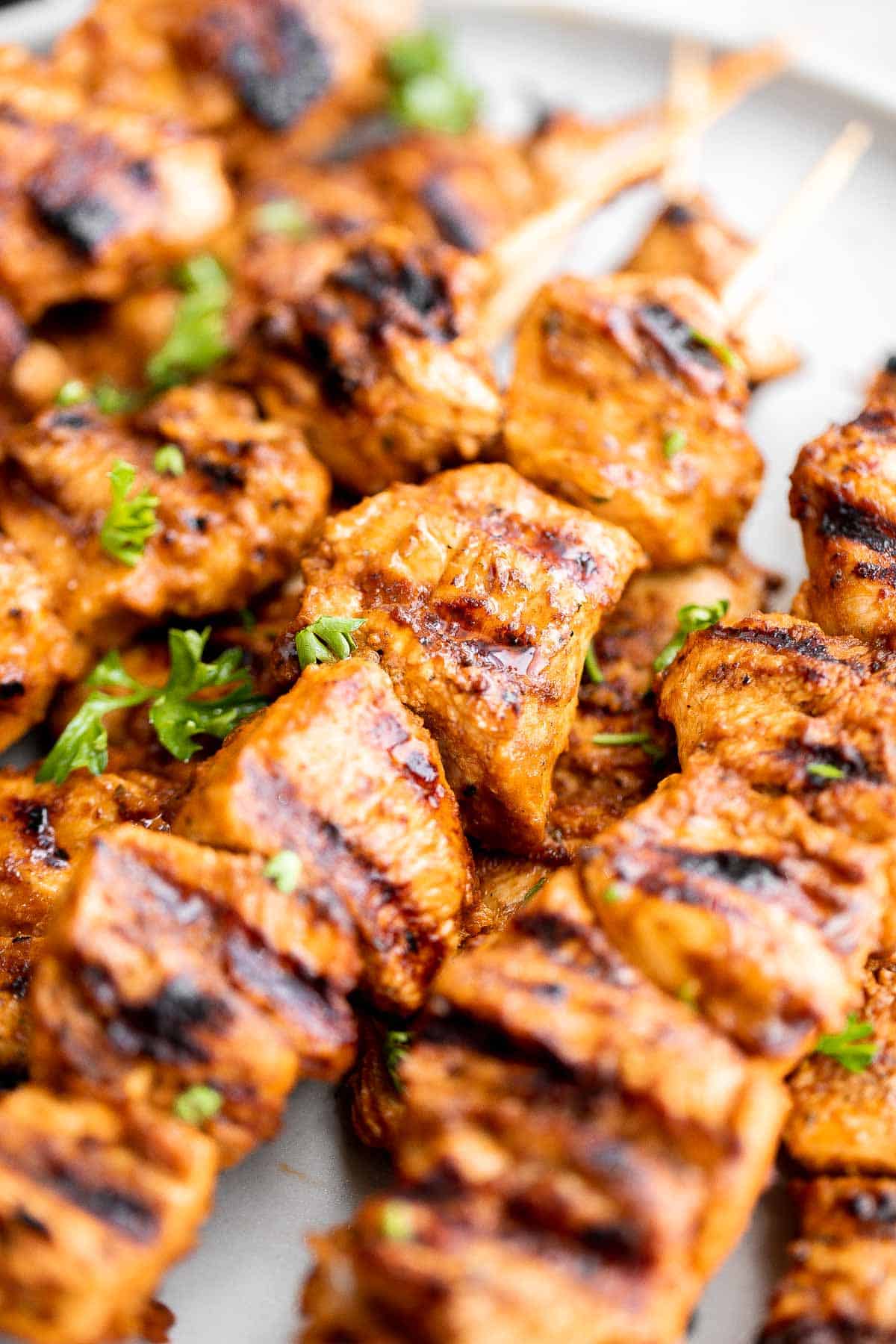 Italian Chicken Skewers are an easy, delicious, and flavorful grilled chicken dinner made with juicy chicken bites smothered in a herby tomato marinade. | aheadofthyme.com