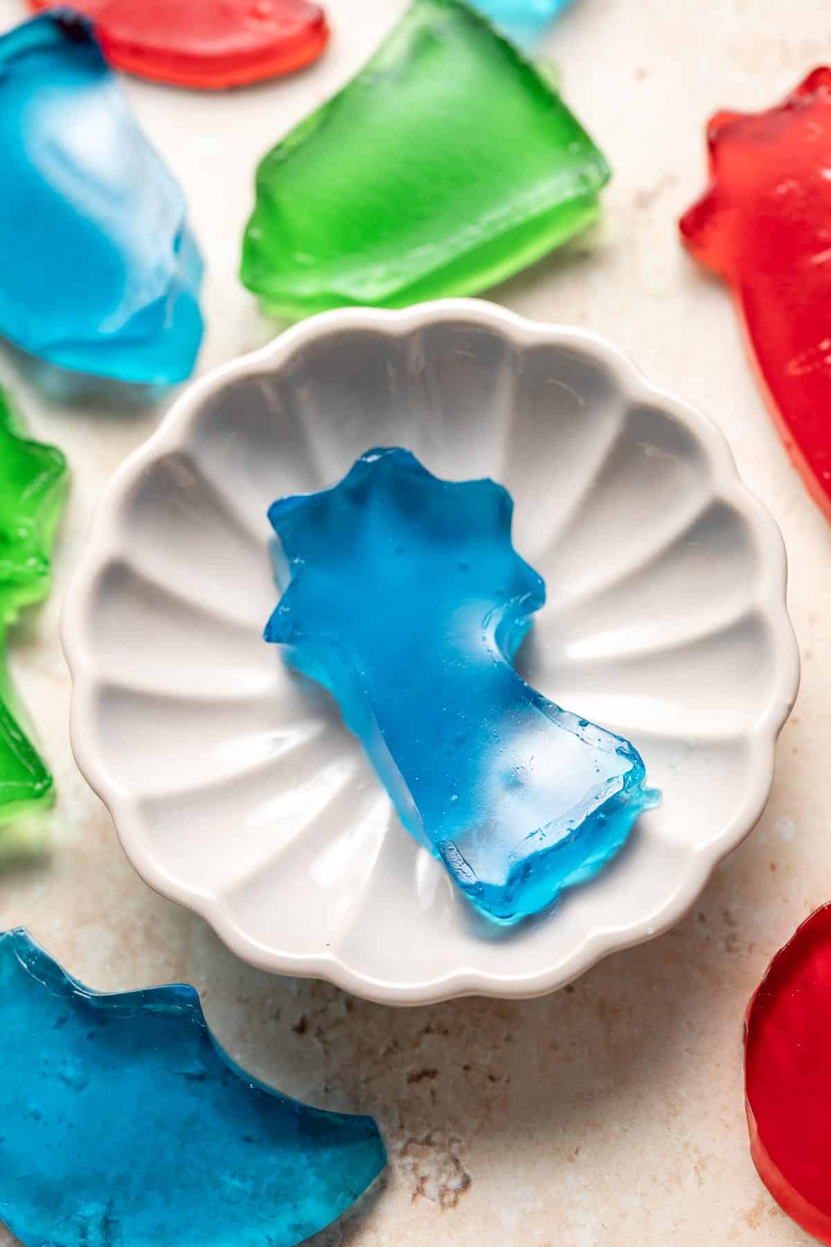 Jello Jigglers are fun, colorful gelatin treats that are smooth in texture and fruity flavored. Customize for any holiday with different colors and shapes. | aheadofthyme.com