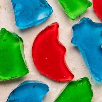 Jello Jigglers are fun, colorful gelatin treats that are smooth in texture and fruity flavored. Customize for any holiday with different colors and shapes. | aheadofthyme.com