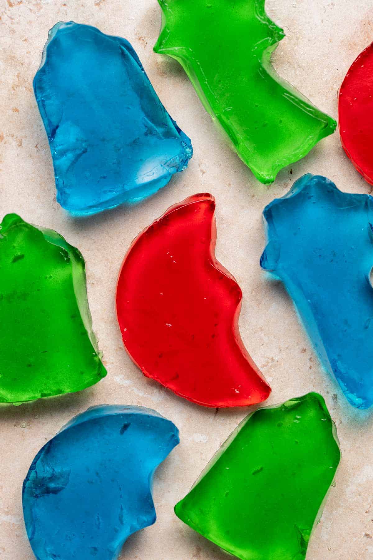 Jello Jigglers are fun, colorful gelatin treats that are smooth in texture and fruity flavored. Customize for any holiday with different colors and shapes. | aheadofthyme.com