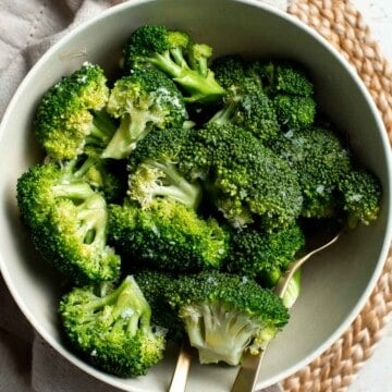 Microwave Steamed Broccoli is tender, buttery, and delicious. With just 4 ingredients, this easy side dish takes minutes to prep and even less time to cook. | aheadofthyme.com