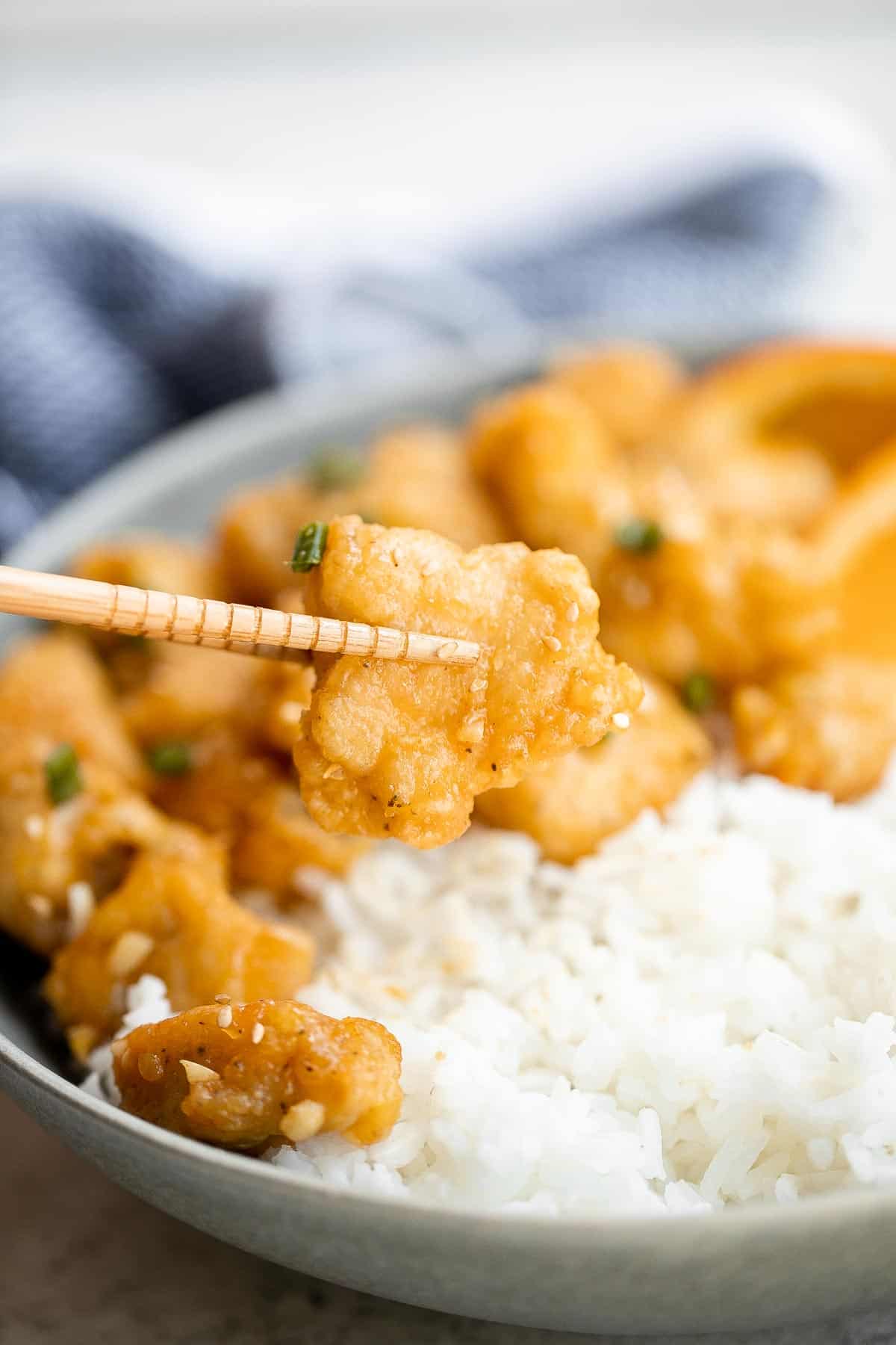 Chinese Takeout Orange Chicken is a quick, easy, delicious meal ready in 30 minutes. It’s healthier than takeout — can be pan-fried, air fried, or baked. | aheadofthyme.com