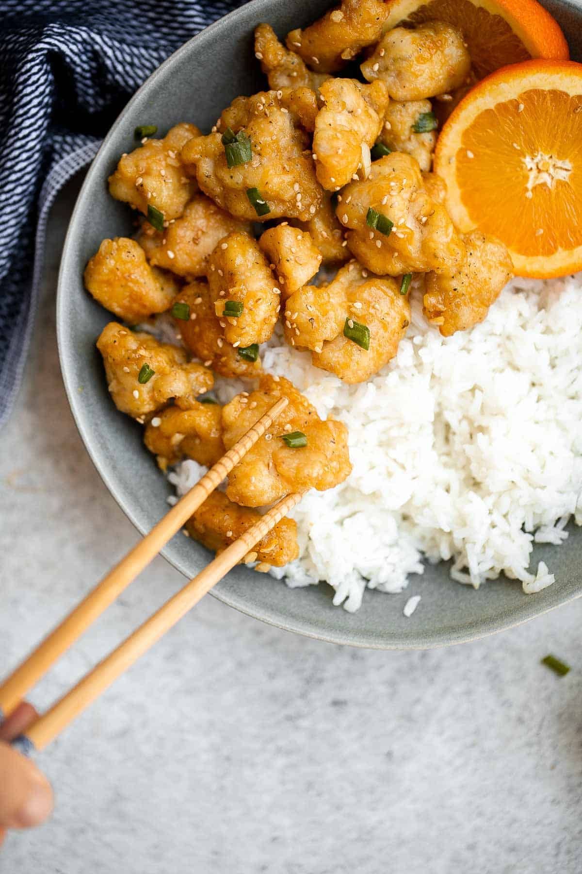 Chinese Takeout Orange Chicken is a quick, easy, delicious meal ready in 30 minutes. It’s healthier than takeout — can be pan-fried, air fried, or baked. | aheadofthyme.com